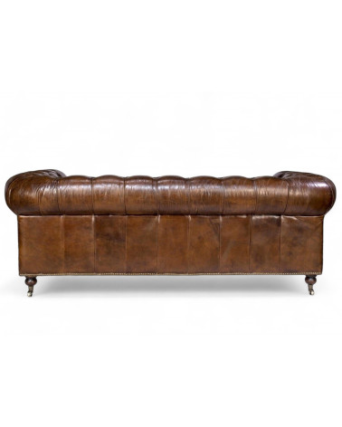 Vue arrière du canapé Chesterfield en cuir vintage marron